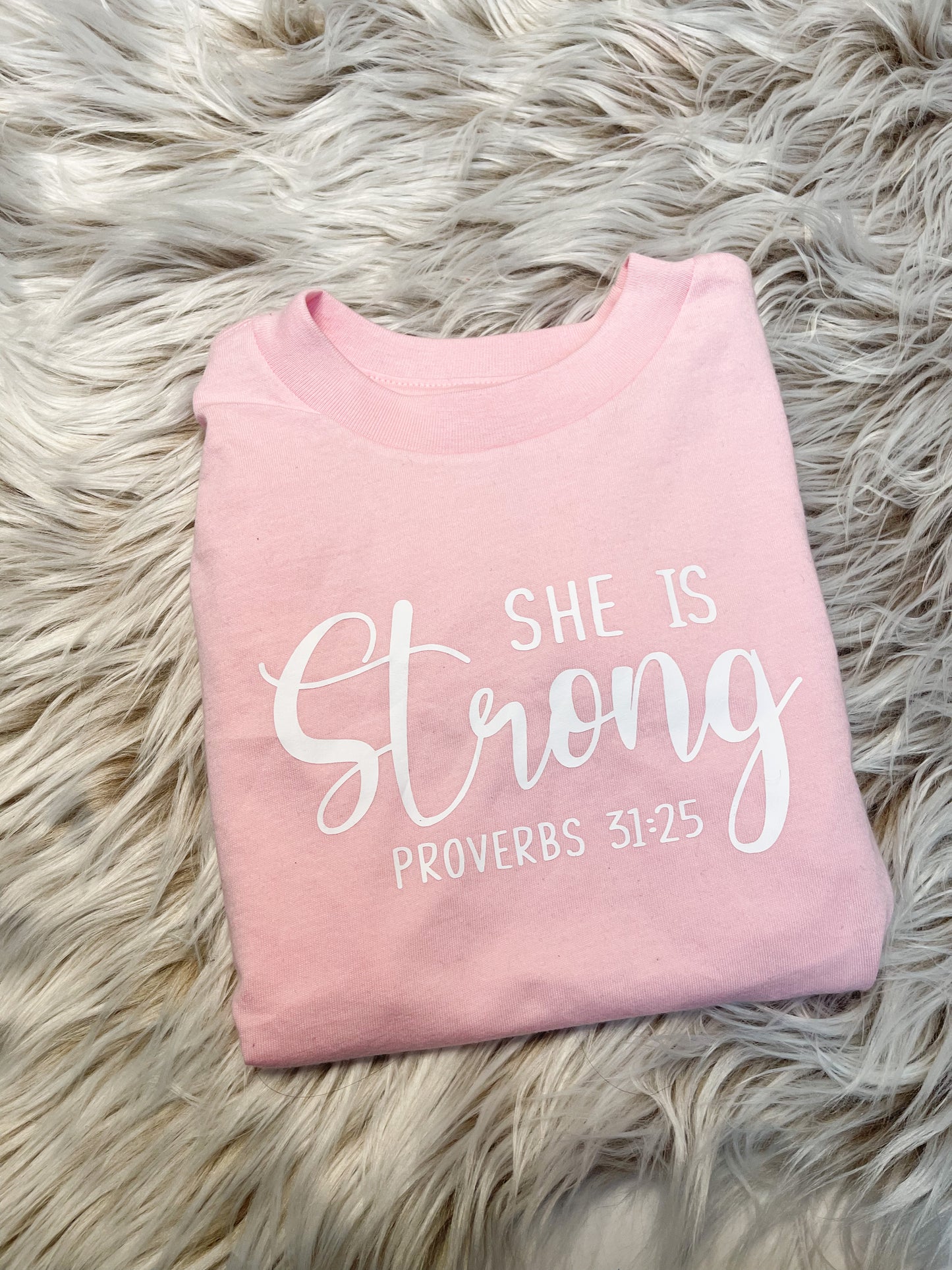 She is Strong Proverbs 31:25 pink T-shirt